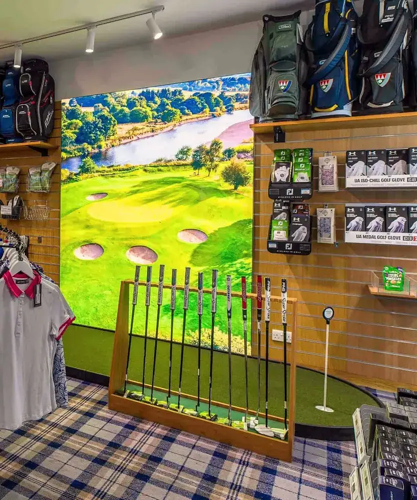 Golf bags, putters and gloves displayed at the Pro Shop